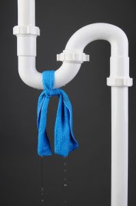 blue cloth tied around white pipe