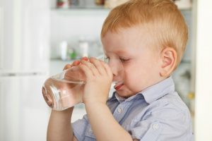 shot of a boy drinking a glass of water