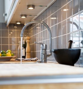 Pouring water in the kitchen