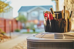 air-conditioner-outside-unit-with-tool-bag-on-top