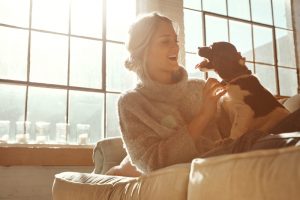 woman-with-dog-enjoying-being-indoors